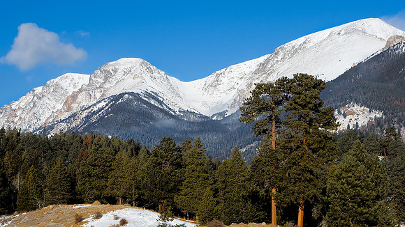 Snow covered Mummy mountain Range on a freezing cold winter morning in Rocky Mountain National Park.