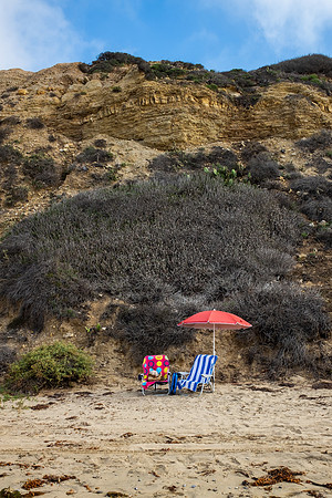12.5 MB, 2742 x 4113: Colorful beach towels. chairs and an umbrella on Newport Beach in California.