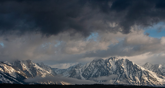 5.39 MB, 3888 x 2076: Storm clouds gathering over the snow covered Tetons in Wyoming.