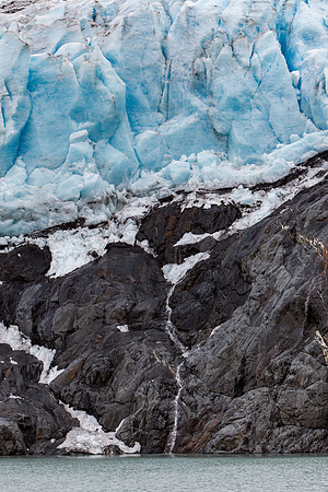 14.6 MB, 3264 x 4896: Melting blue and white Portage Glacier creates a cascade waterfall