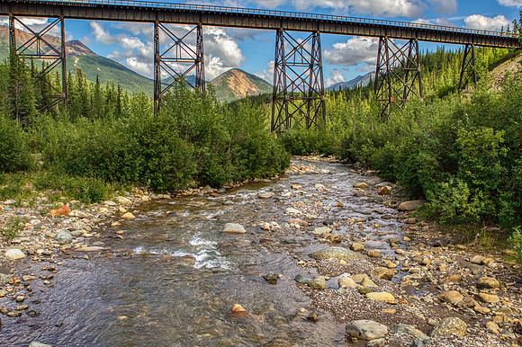 15.7 MB, 4915 x 3273: Trellis railroad bridge over a flowing stream