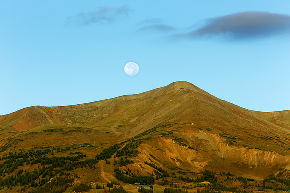 16.5 MB, 5184 x 3456: The moon setting over the mountain peaks above Breckenridge, Colorado.