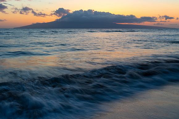 10.4 MB, 5184 x 3456: Orange sun light at sunset reflected off the gentle Maui surf.