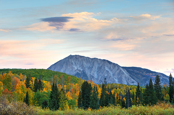 14.4 MB, 4956 x 3279: Marcellina Mountain stands between the Colorado fall colors and the calm pastel morning skies.