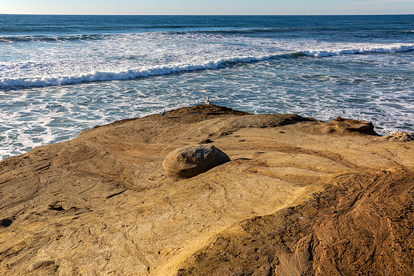 27.5 MB, 5760 x 3840: Ocean waves approach a rocky beach near San Diego, California.