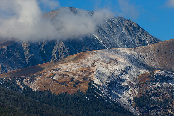 18.4 MB, 5184 x 3456: The peak of Mt. Quandary peaking from behind low clouds near Breckenridge, Colorado.