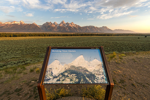 26.1 MB, 6720 x 4480: A sign from the National Park Service showing the impact of climate change as the Grand Tetons loom in the background.
