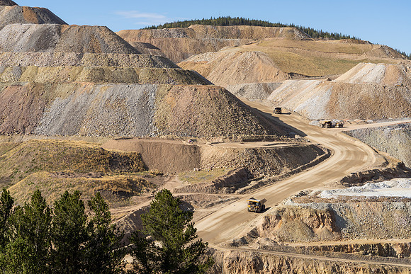 40.5 MB, 7000 x 4667: Heavy Trucks Hauling Loose Rock in Open Pit Gold Mine