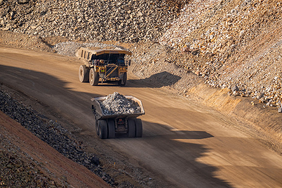 17.6 MB, 4689 x 3126: Two Large Yellow Dump Truck Carrying Rock